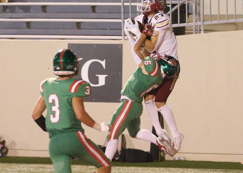 Morris's Jack Wheeler leaps in the air to make a catch for a touchdown over L-P's Adrian Arzola as teammate Michael Hartman watches on Friday, Sept. 20, 2024 at Howard Fellows Stadium.