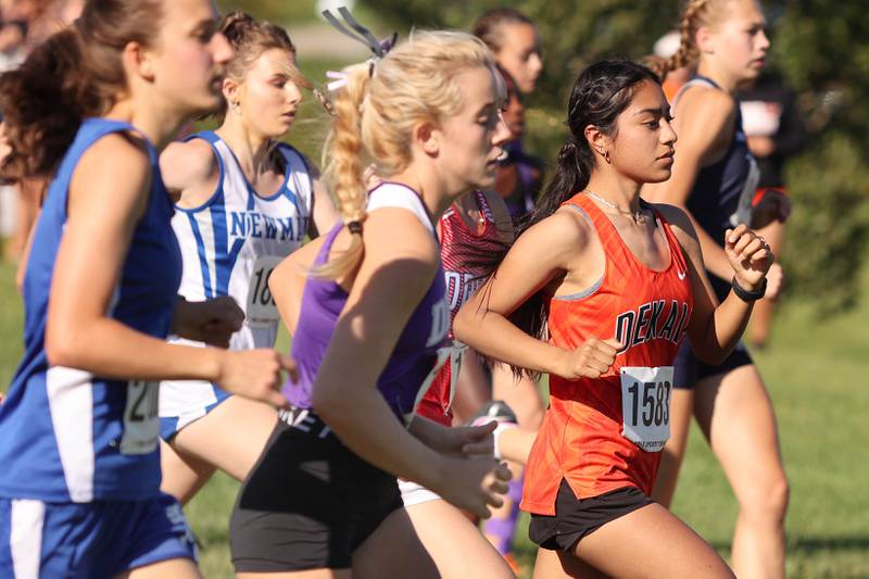 DeKalb's Brenda Aquino (right) gets out fast in the girls race Tuesday, Aug. 30, 2022, during the Sycamore Cross Country Invitational at Kishwaukee College in Malta.