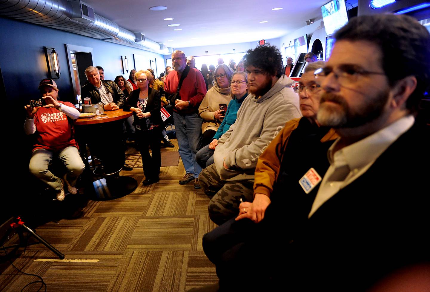 People listen to Darren Bailey, a Republican candidate for Illinois governor, speak Thursday, March 3, 2022, during a stop at the Little Chef Restaurant in McHenry. Bailey, who is one of several Republicans expected to run for a governor, spoke to a room full of people during the first of four scheduled campaign stops Thursday.