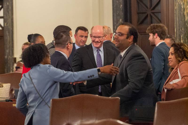 Lawmakers in the Illinois Senate celebrate Sunday night after passing a budget.