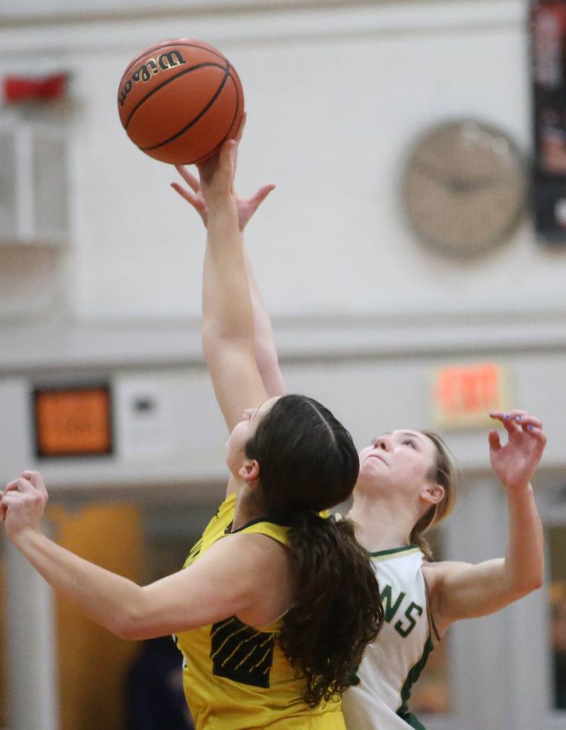 Putnam County's Maggie Richetta wins a jump ball over St. Bede's Ashlyn Ehm during the Tri-County Conference Tournament championship game on Thursday, Jan. 18, 2024 at Henry-Senachwine High School.