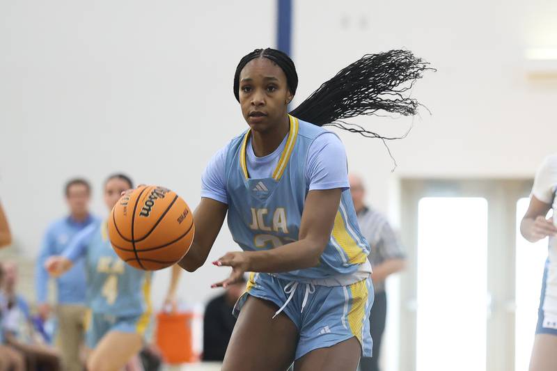 Joliet Catholic’s Symone Holman looks to make a play against Reavis in the Peotone Blue Devils Holiday Classic championship game on Monday, Dec. 29, 2025 in Peotone.
