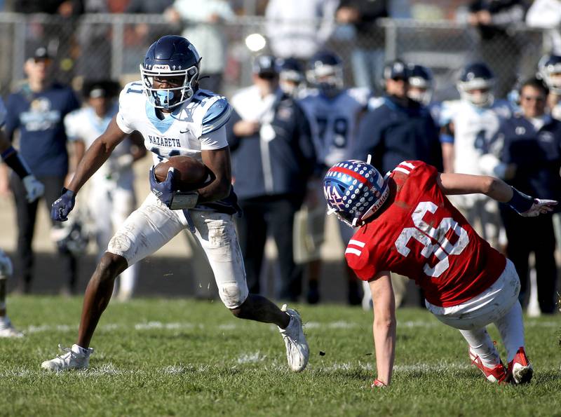 Nazareth's Quentrell Harris (11) carries the ball during a Class 5A second-round game at Marmion in Aurora on Saturday, Nov. 6, 2021.