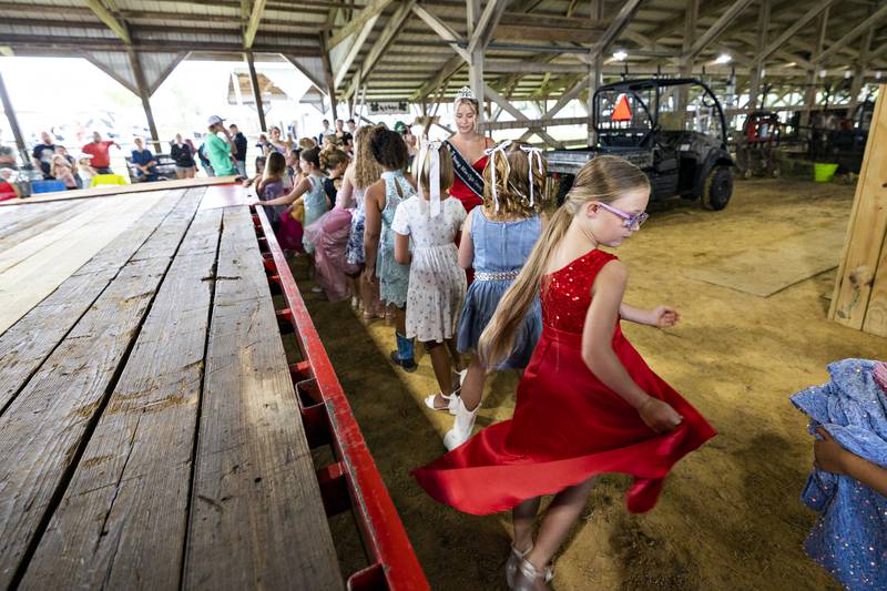 Aurora Vaughan twirls in her dress while competing in the Ogle County Little Miss pageant Wednesday, July 30, 2025.