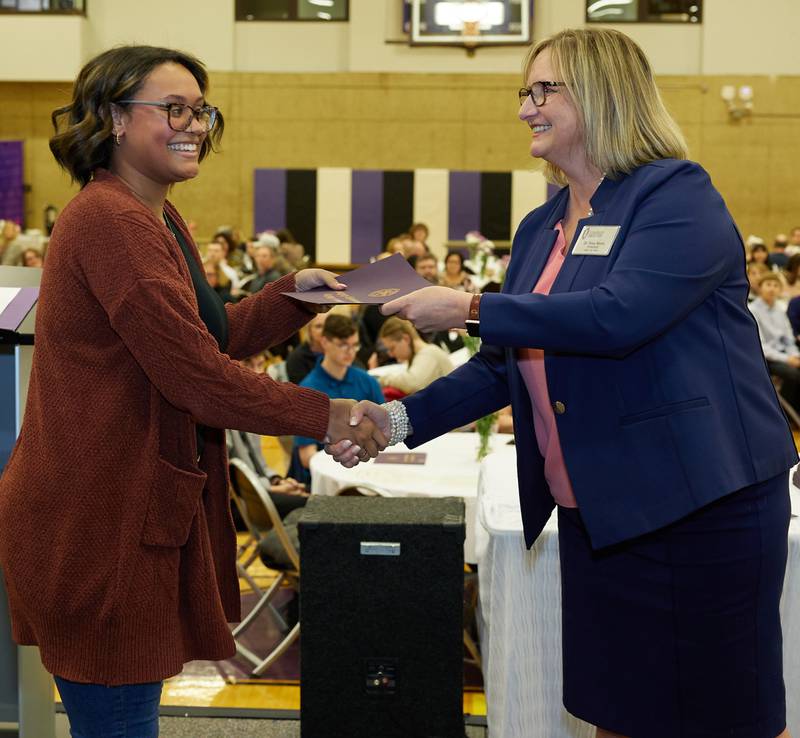 Natalia Webb, of Streator, accepts a certificate from Illinois Valley Community College President Tracy Morris during the annual Student Academic Awards Ceremony last week. IVCC recognized McCormack Scholars, Phi Theta Kappa All-Illinois Academic Team and Richard Publow Memorial Writing Award winners, as well as students who earned academic honors in two and three consecutive semesters.