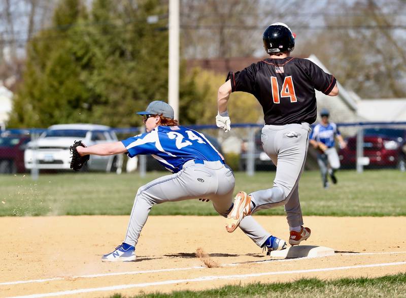 Jimmy Starkey stretches at first base for the throw