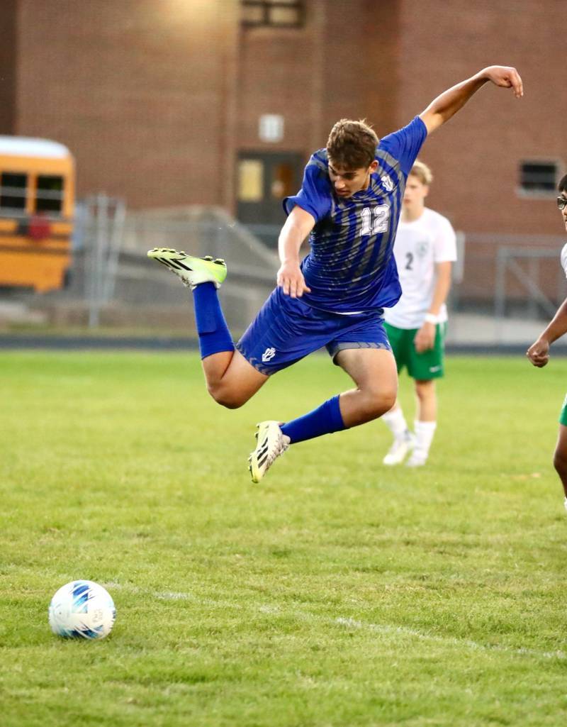 Princeton junior Asa Gartin goes airborne to make a play on a ball against Alleman Thursday night at Bryant Field. The visiting Pioneers won 8-0.