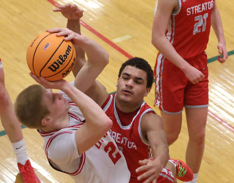 Ottawa's George Shumway is fouled by Streator's Layzeric Moton in the lane during the Class 3A Regional semifinal game on Wednesday, Feb. 25, 2026 in Sellett Gymnasium at L-P High School.