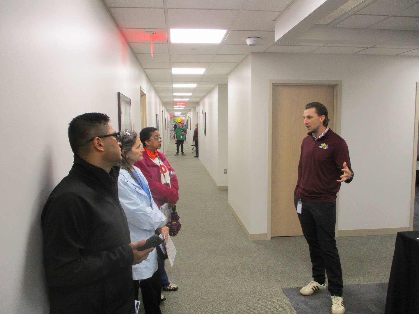 John Hall, business service supevisor at the Workforce Center of Will County, talks with visitors during tours of the center's new offices at 1300 Copperfield Ave., Joliet. April 27, 2026