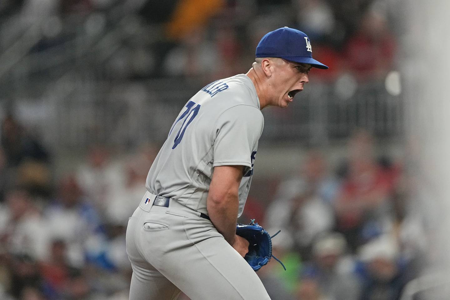 Los Angeles Dodgers rookie stating pitcher Bobby Miller reacts after recording the final out in the fifth inning against the Atlanta Braves, Tuesday, May 23, 2023, in Atlanta. The game was Miller's Major League debut.