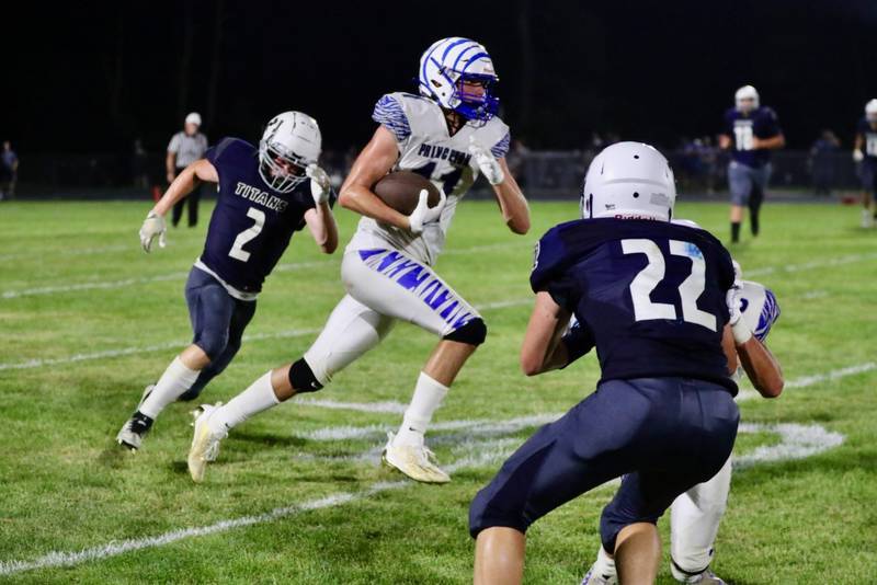 Princeton's Noah LaPorte races down the sidelines Friday night at Monmouth. The Tigers won 40-0.