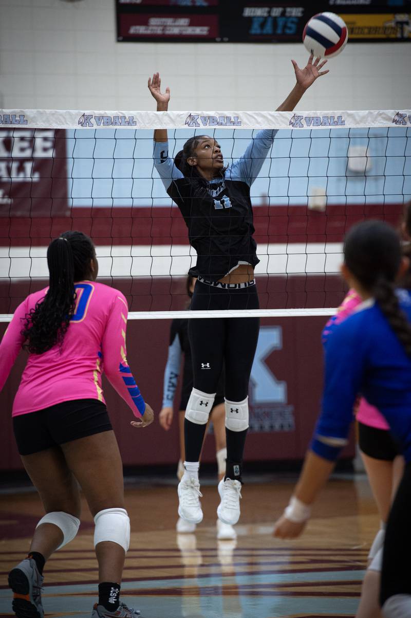 Kankakee's Shania Johnson elevates to try and block a hit during a match against Bloom on Tuesday, October 14, 2025.