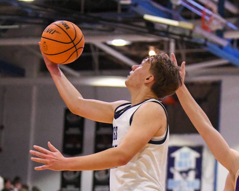 Downers Grove South's Daniel Sveiteris (25) makes a shot during the game on Saturday Dec. 21, 2024, while taking on Downers Grove North held at Downers Grove South High School.