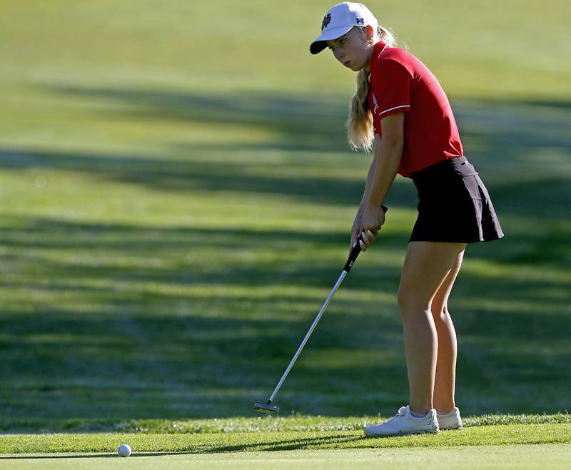 Dundee-Crown’s Sophie Morawski lines up a putts on the10th green during the Fox Valley Conference Girls Golf Tournament Wednesday, Sept. 25, 2024, at Crystal Woods Golf Club in Woodstock.