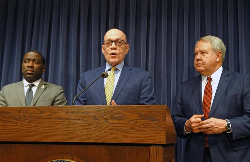House Majority Leader Greg Harris, D-Chicago, speaks on the House's action to pay down debt Thursday night. He's accompanied by Rep. Marcus Evans, D-Chicago, and Rep. Jay Hoffman, D-Swansea, in the Capitol news conference room.
