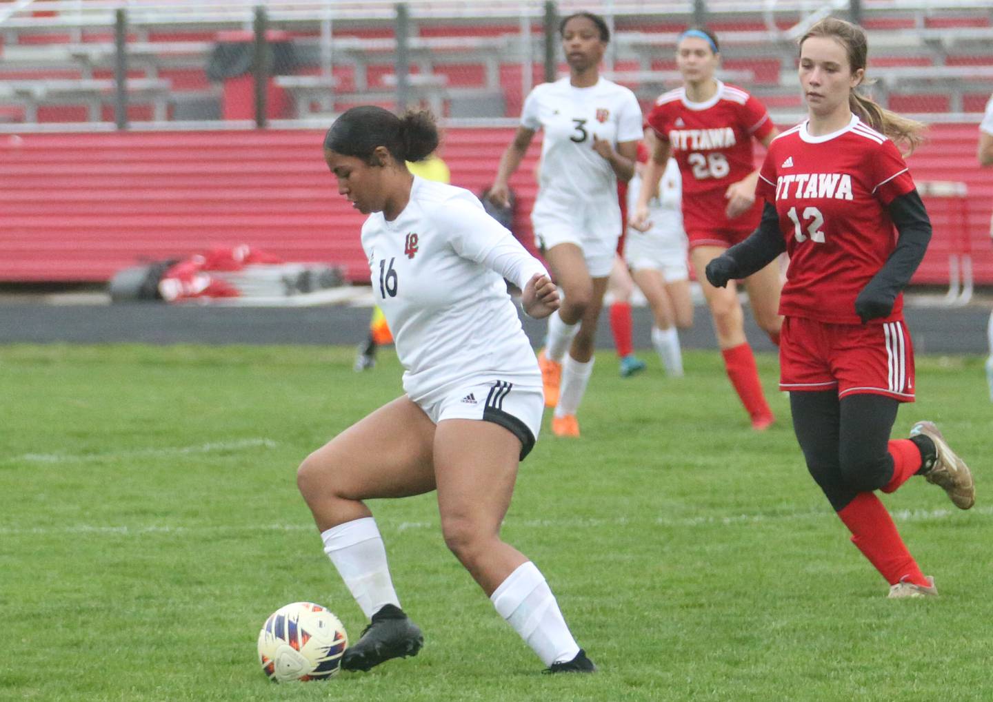 L-P's Aiyanna Smith keeps the ball away from Ottawa's Chloe Carmona on Wednesday, April 30, 2025 at King Field in Ottawa.