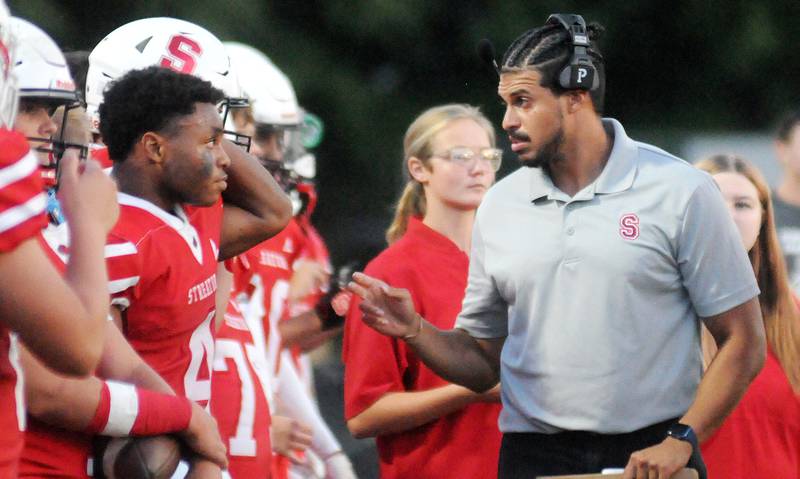 Streator head coach Jay Slone talks to his players on Friday, Aug. 29, 2025 at Doug Dieken Stadium in Streator.