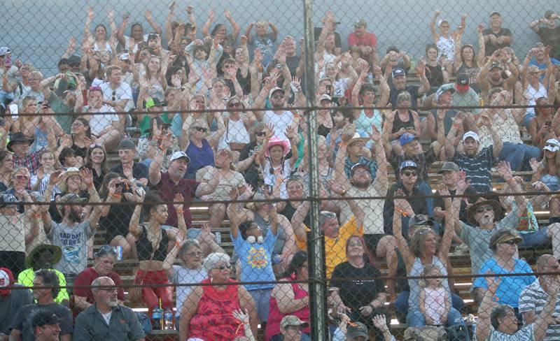 The crowd does "the wave" during the Starved Rock Rodeo on Saturday, June 21, 2025 at the La Salle Speedway.