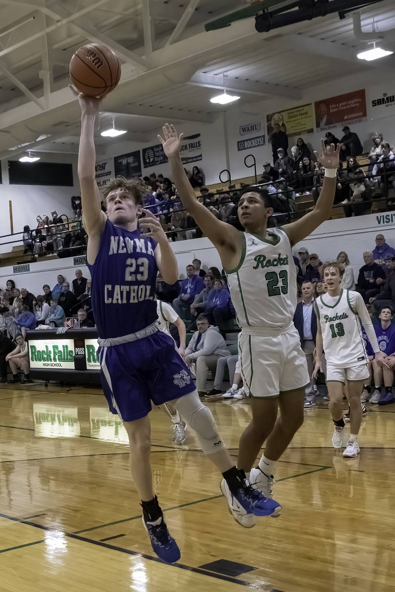 Newman's Lucas Simpson (23) shoots a layup in front of Rock Falls' Diego Hernandez during their nonconference game Wednesday, Feb. 15, 2023 at Tabor Gym.
