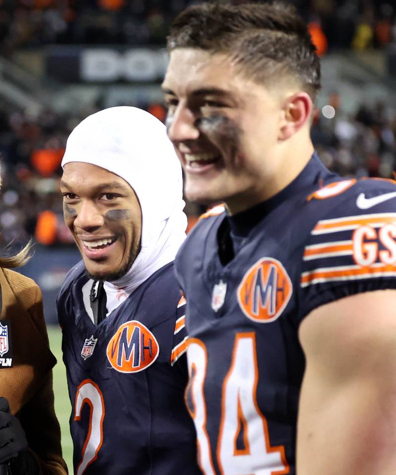 Chicago Bears wide receiver DJ Moore (left) and tight end Colston Loveland are all smiles after their win Saturday, December 20, 2025, over the Green Bay Packers at Soldier Field in Chicago.