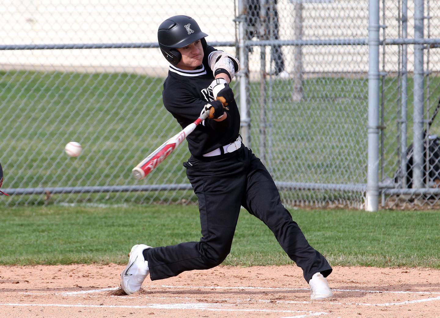 Kaneland's Alex Panico swings and misses at a pitch against L-P on Wednesday, April 5, 2023 at Dickinson Park in Oglesby.