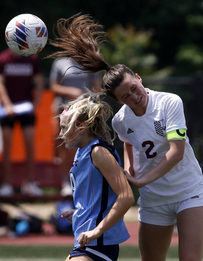 St. Ignatius College Prep's Quinn Urquhart (right) heads the ball over Nazareth Academy's Olivia O'Neill during a IHSA Class 2A State Girls Soccer semifinal match on Friday, June 6, 2025, at North Central College in Naperville.