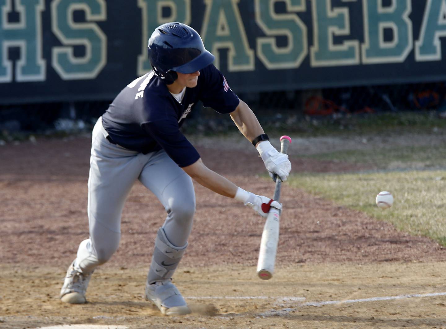 Cary-Grove's Ryan Koltz lays down a bunt during a nonconference baseball game against Woodstock North on Monday, March 30, 2026, at Woodstock North High School.