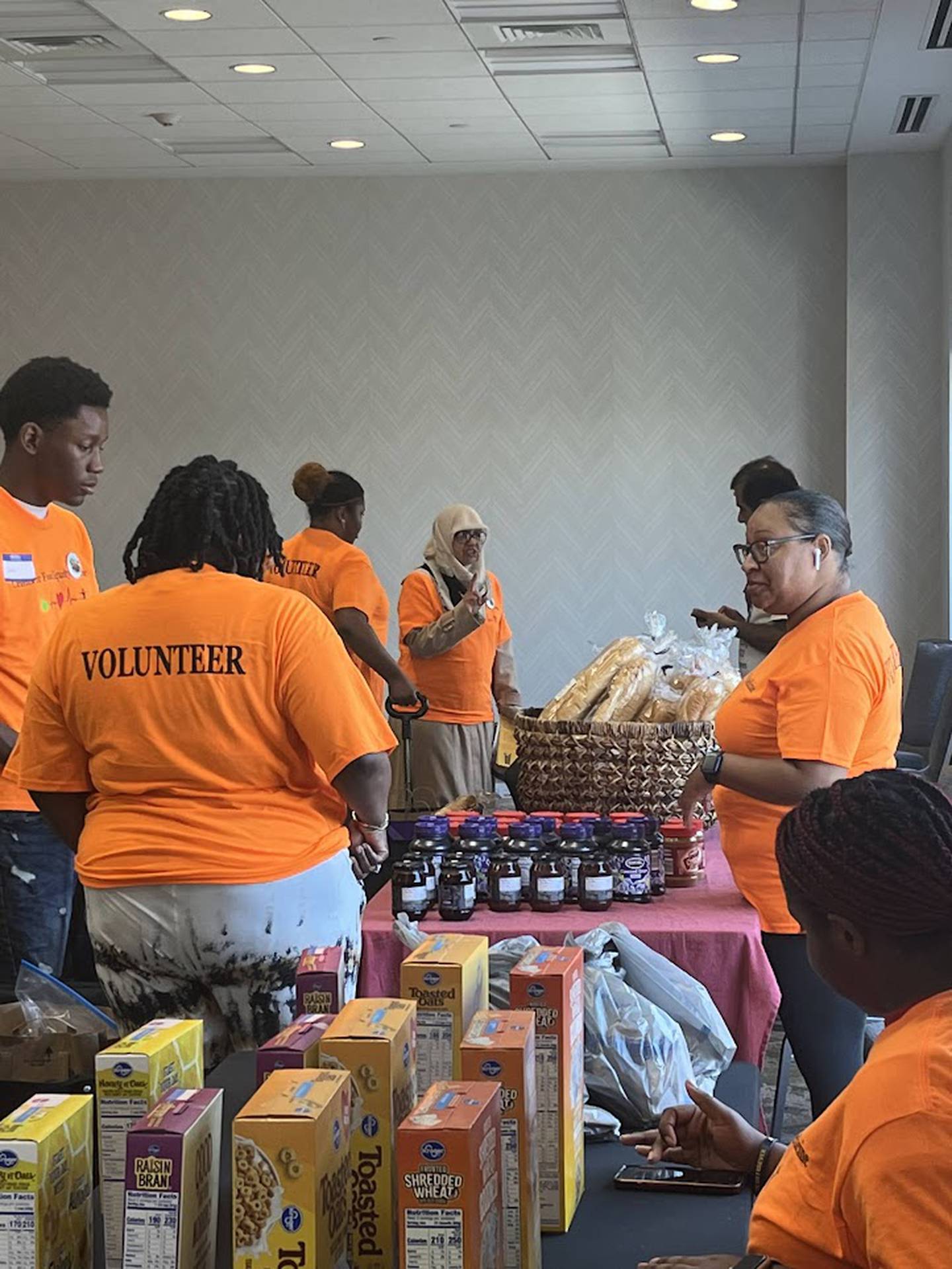 Volunteers work at a pop-up Complimentary Nutrition Station for the community, hosted by the Center for Food Equity in Medicine. The center's founder, Ann Jackson, inspired Joliet social worker Paul Dickerson to found his own nonprofit to help provide healthy food to cancer patients in Will County.