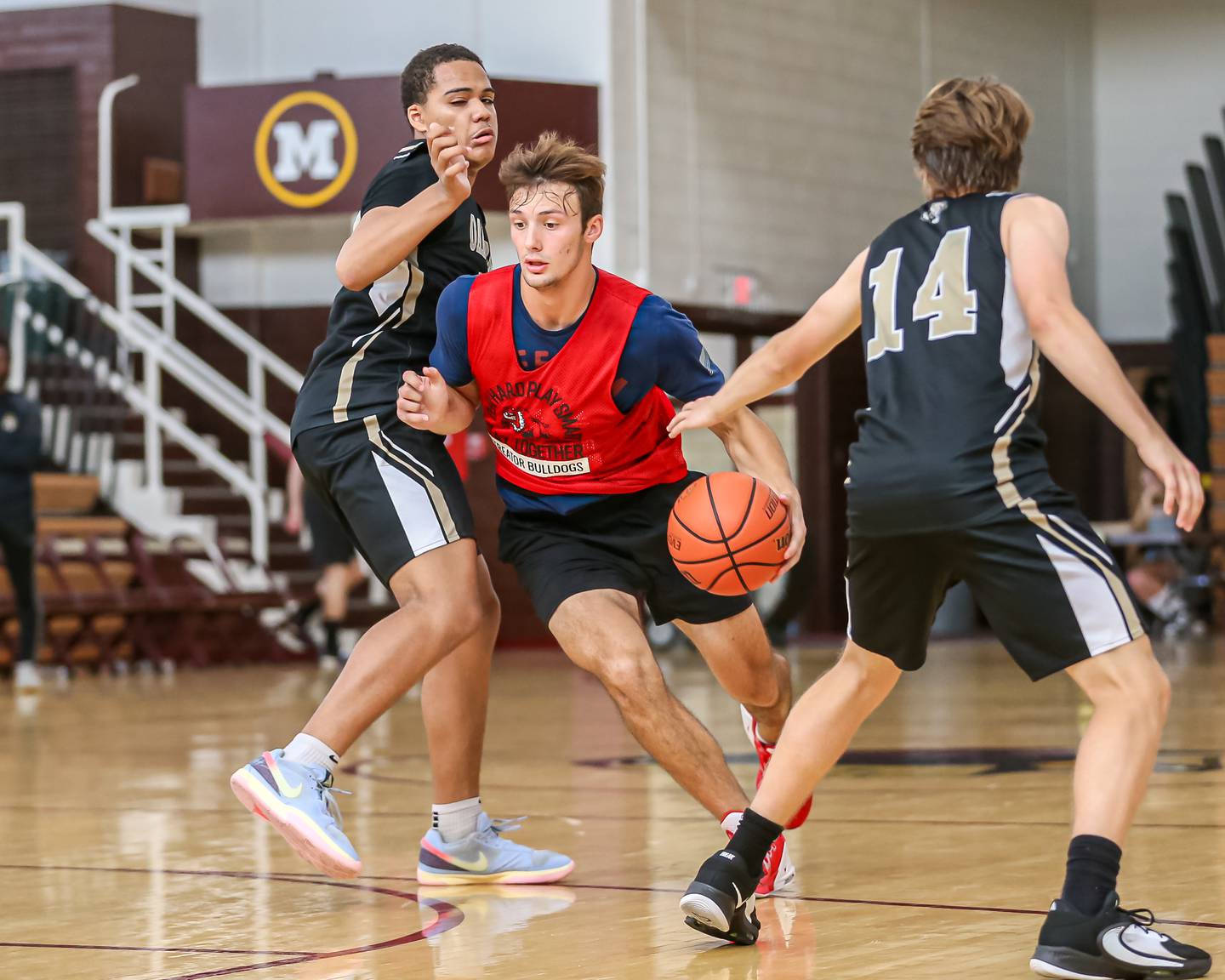 Streator's Christian Benning drives between two defenders at the Morris Shootout on Wednesday, June 21, 2023.