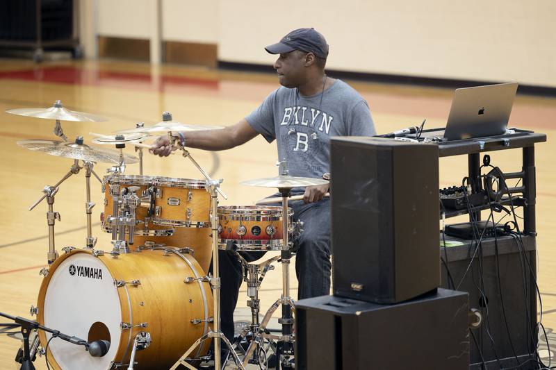 Danya Thomson gives an example of his drum technique Friday, March 24, 2023 during at clinic at East Coloma-Nelson school in Rock Falls.