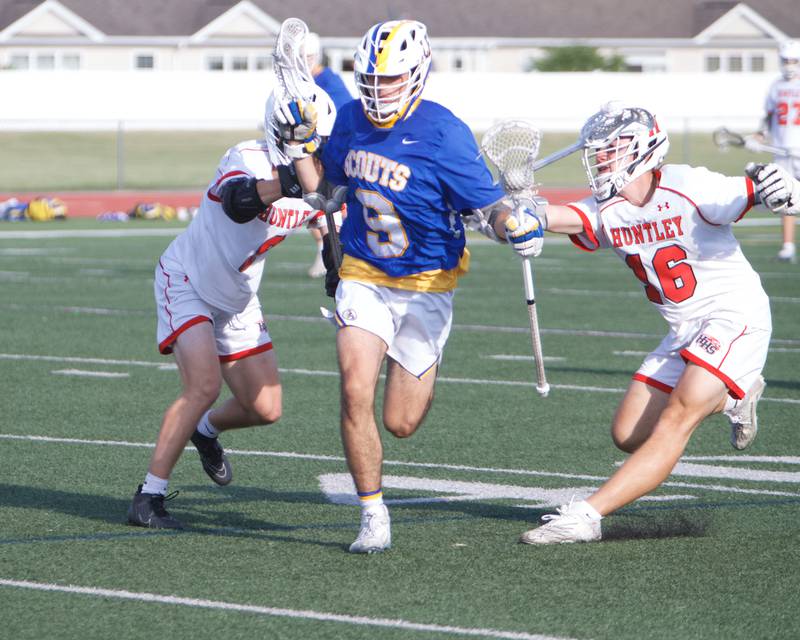 Huntley's Liam Manning (8) and Connor Ardell (16) look to stop Lake Forest's Robert Pasinato at the Super Sectional Final on Tuesday, May 30, 2023 in Huntley.