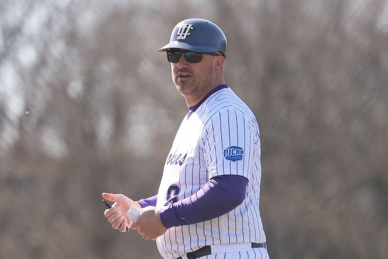 Joliet Junior College head coach Gregg Braun coaches from third base against Illinois Valley in game one of their double-header at the Wolves home opener on Sunday Mar. 3rd, 2024 in Joliet.