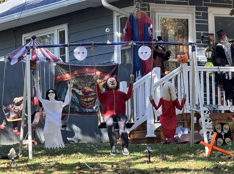 Spooky Halloween characters swing on a swing set at a home near the corner of 16th street and Guiles Avenue on Thursday, Oct. 17, 2024 in Mendota.