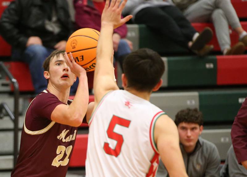 Morris's Brett Bounds shoots a jump shot over L-P's Erick Sotelo on Friday, Dec. 6, 2024 in Sellett Gymnasium at L-P High School.
