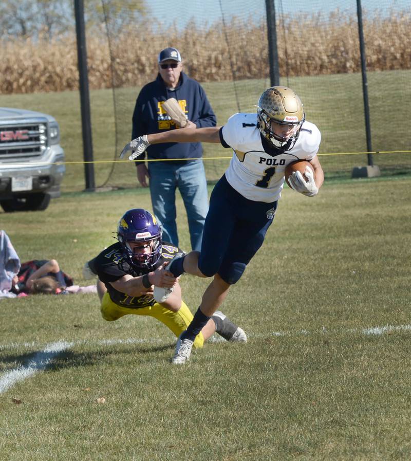 Polo's Mercer Mumford (1) escapes an Orangeville defender and heads to the endzone during 8-man action against the Broncos on Saturday, Oct. 26, 2024 in Orangeville.