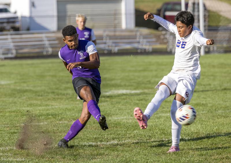 Dixon’s Quintynn Sarver kicks the ball upfield against Genoa-Kingston’s Sebastian Lara Tuesday, Sept. 2, 2025.