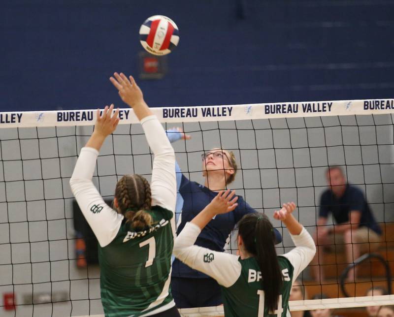 Bureau Valley's Emma Stabler hits the ball between St. Bede's Reagan Stoudt and teammate Aubree Acuncius on Tuesday, Sept. 5, 2023 at Bureau Valley High School.