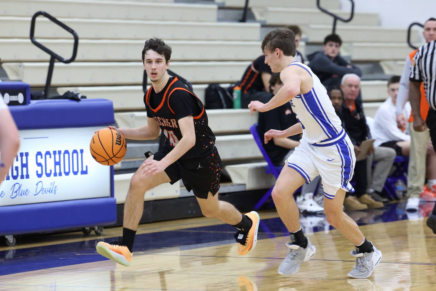 Beecher's Dominick DeFrank brings the ball up against Peotone's Nate Wehrmann during the Blue Devils' 64-52 victory over Beecher on Wednesday, Jan. 28, 2026.