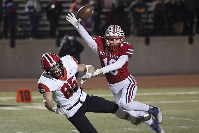 West Central’s Colton Fletcher and Amboy’s Brennan Blaine get tangled up Friday, Nov. 18, 2022 in the 8-man championship football game. Fletcher was called for a pass interference.