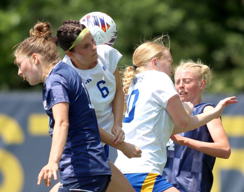 Johnsburg’s Liz Smith, center left, and Kayla Hiller, center right, battle Willows Academy’s Julia Lechner, left, and Bernadette Presberg, right,  in IHSA Class 1A Supersectional soccer action at Dominican University in River Forest on Saturday, May 31, 2025.