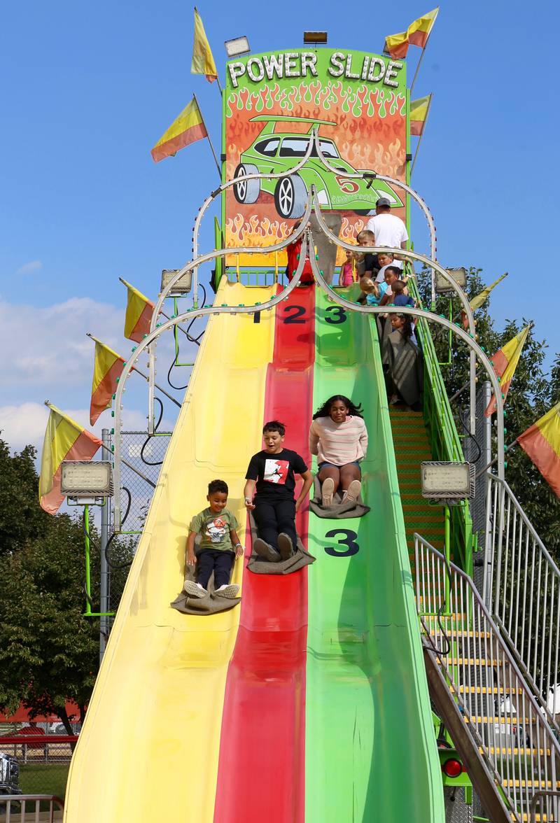 Kids have fun on the Power Slide at Yorkville's Hometown Days festival at Beecher Community Park at 908 Game Farm Road, Yorkville on Saturday, Aug. 30, 2025.