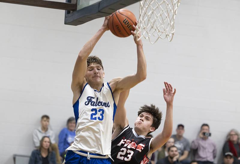 Faith Christian’s Levi Schuler pulls down a rebound Thursday, Dec. 15, 2022 while playing Rockford Fire.