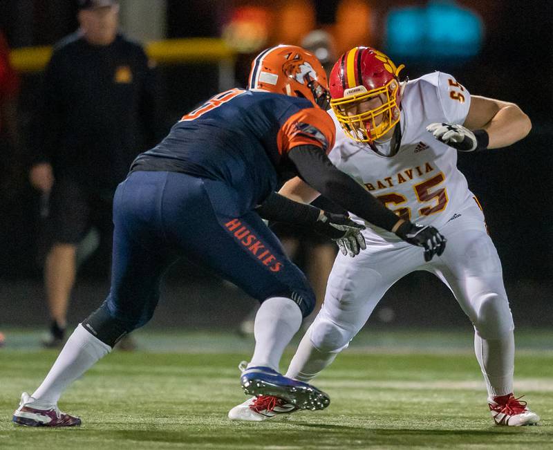 Batavia’s John Smith (65) blocks Naperville North's Nicholas Esposito (9) in Naperville Sept. 6.