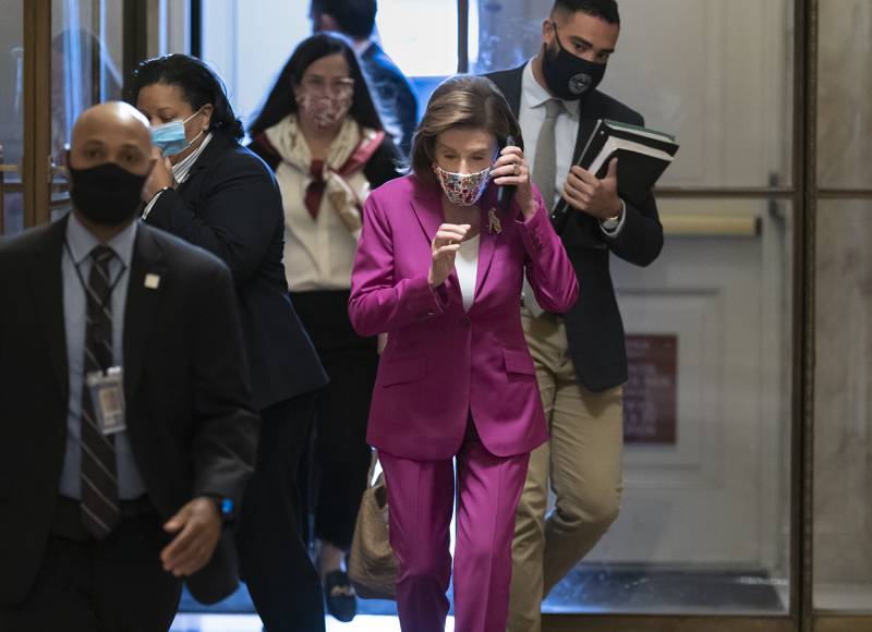 Speaker of the House Nancy Pelosi, D-Calif., arrives to lead Democrats in advancing President Joe Biden's $1.85 trillion-and-growing domestic policy package, at the Capitol in Washington, Friday, Nov. 5, 2021. The hard-fought social policy and climate-change legislation will still have to clear the 50-50-Senate, where revisions are likely and Biden has no votes to spare. (AP Photo/J. Scott Applewhite)