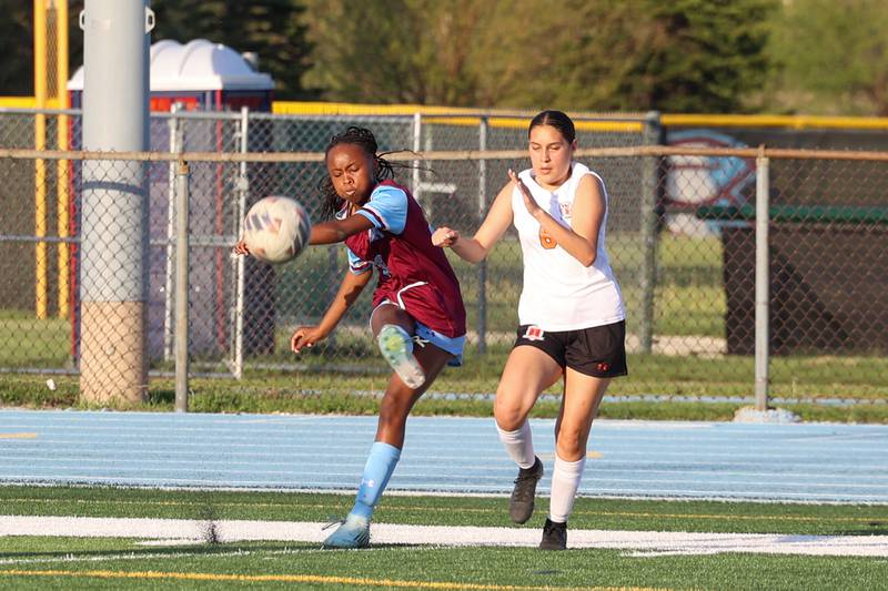 Kankakee's Alina Mkhwanazi sends a cross into the box during Kankakee's 8-4 victory over Beecher on Wednesday, April 22, 2026. Mkhwanazi tallied six goals for the Kays in their win in Southland Athletic Conference play.