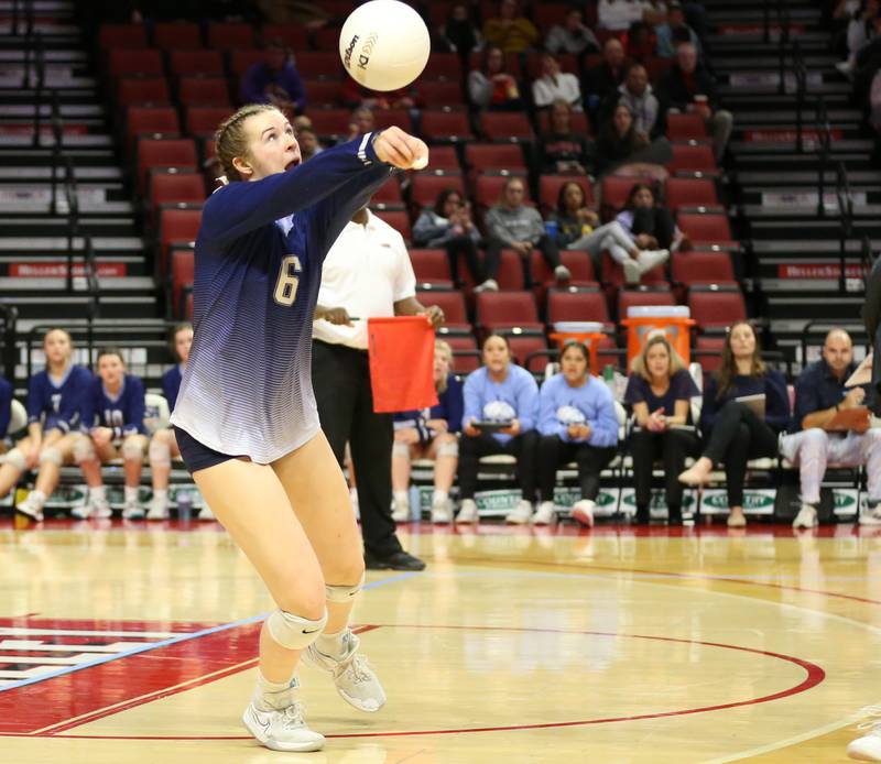 Nazareth Academy's Kitty Sandt returns a serve against Taylorville in the Class 3A semifinal game on Friday, Nov. 11, 2022 at Redbird Arena in Normal.