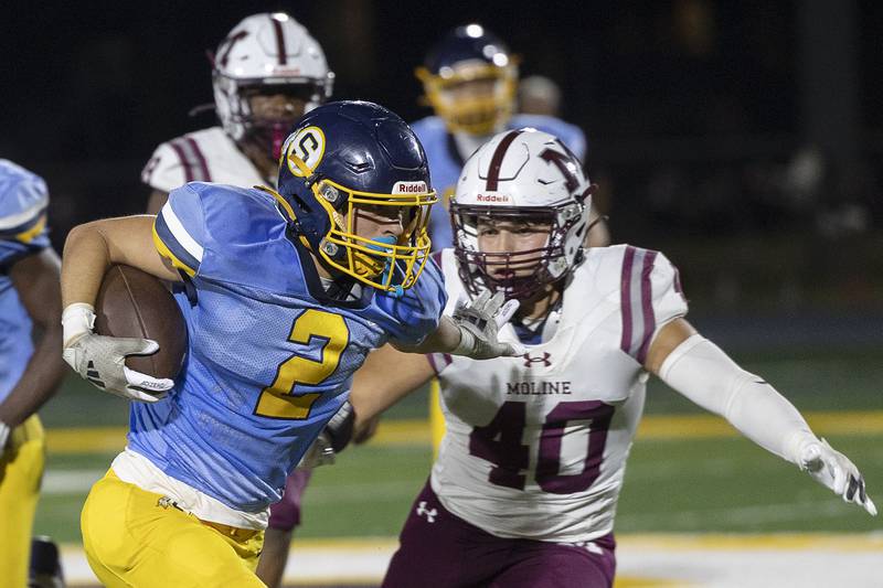 Sterling’s Cobey Shipma stiff arms Moline’s Payton Lawrence Friday, Sept. 12, 2025.