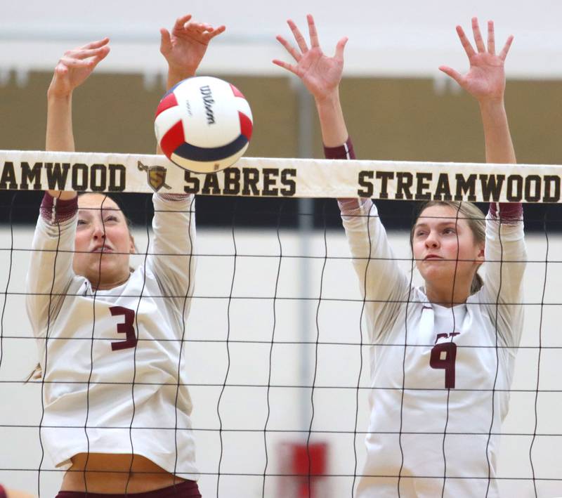 Prairie Ridge’s Abby Smith, left, and Harleigh Serpico block against St. Viator in IHSA Class 3A Super-Sectional girls volleyball at Streamwood High School in Streamwood on Monday, November 10, 2025.