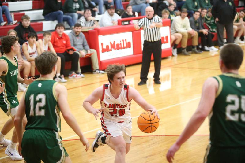 LaMoille's Tate Sundberg catches a pass between St. Bede defenders Carson Riva and Jake Miglorini on Tuesday, Feb. 11, 2025 at LaMoille High School.