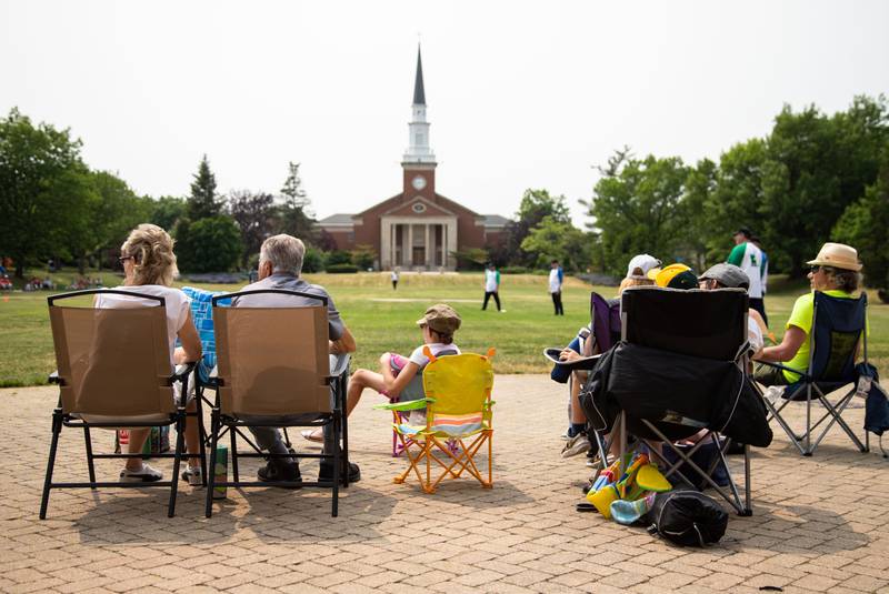 Fans sit and watch the Elmhurst Heritage Foundation's Vintage Baseball Game at Elmhurst University Mall on Sunday, June 4, 2023.